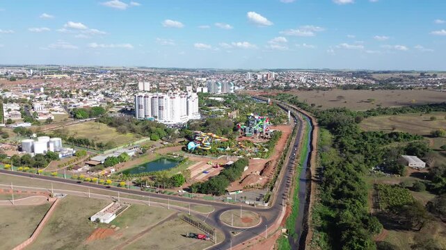 Aerial drone view of Ol&iacute;mpia city with water park and urban skyline, S&atilde;o Paulo, Brazil