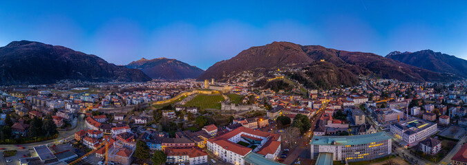 Sunset view of Bellinzona with Castelgrande, Castello di Montebe © dudlajzov