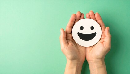 Hands Holding a Smiling Emoji, Representing Positivity and Support