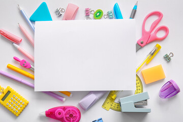 Composition with blank paper sheet and different school stationery on white background, closeup © Pixel-Shot
