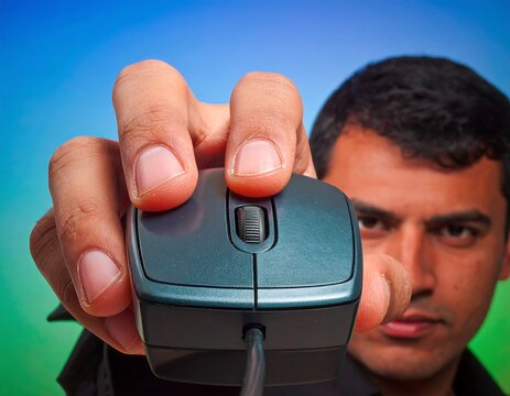 Close-up of hand holding computer mouse