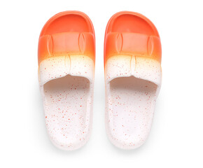 Orange female flip flops on white background