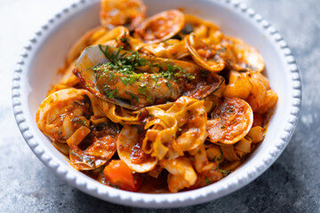 italian seafood pasta in tomato sauce