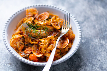 italian seafood pasta in tomato sauce