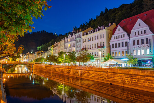 Night view of colourful houses reflecting on Tepla river in Karl
