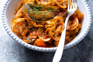italian seafood pasta in tomato sauce