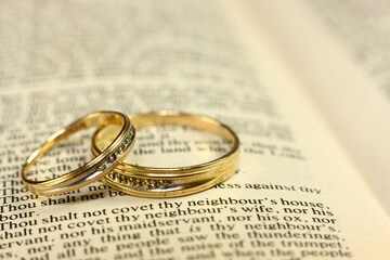Wedding Rings on Bible Pages