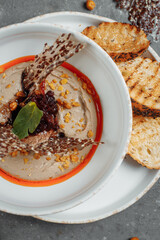 Mushroom cream soup on dark background. Champignon soup
