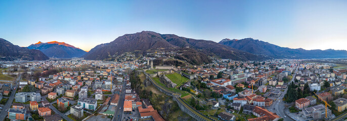 Sunset view of Bellinzona with Castelgrande, Castello di Montebe © dudlajzov