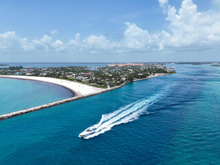 Aerial view of boat heading to sea in Fort Pierce Inlet on the Treasure Coast of Florida in St. Lucie County