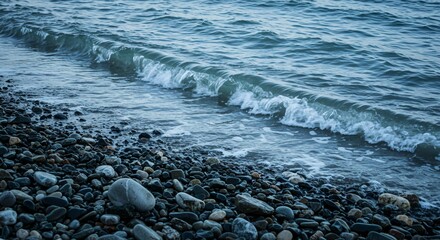Smooth Stone Beach Under a Serene Blue Tide