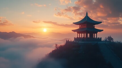 Fototapeta premium Scenic view of a pagoda on a mountaintop at sunset