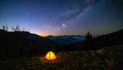 Obraz premium Glowing Orange Tent Under a Dramatic Starry Sky in a Mountain Valley
