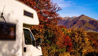 Autumnal RV parked by mountains