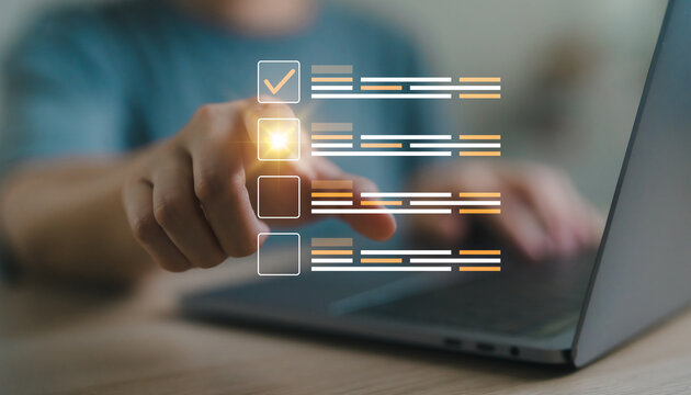 Close-up hand pointing to digital checkbox on laptop, online assessment, questionnaire, exam, survey, checklist, multiple choice, test form or evaluation process in digital education system concept.