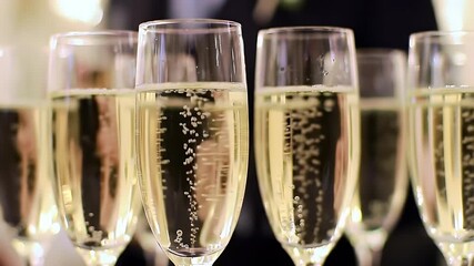 Close Up View Champagne Flutes Filled With Sparkling Beverages for Celebration Featuring Rising Bubbles Catching Light Suitable for Festive Wedding and Party Themes and Decoration Uses