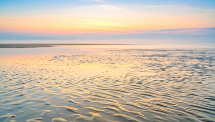 Golden Sunrise Over Calm Beach Water