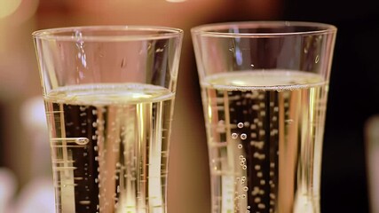 Elegant Champagne Toast Two Flutes Filled with Sparkling Champagne on Blurred Background Celebration Close Up Revealing Golden Bubbles Perfect for New Year Wedding or Special Occasion