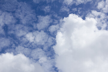 The sky is covered with fluffy clouds.