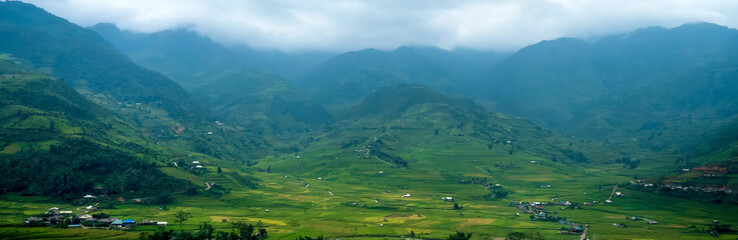 Banner Beautiful Mountain landscape foggy mountain green landscape morning sunrise. Amazing Landscape mountain green tropical forest tree on sunrise. Banner forest sunlight scenery with copy space
