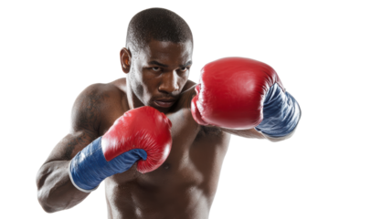 Athlete practicing boxing with determination, focused on training in a powerful stance.