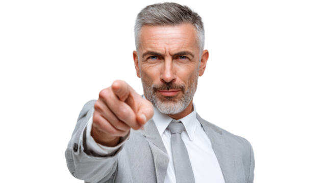 Confident businessman pointing with emphasis in a professional setting, isolated on white background.