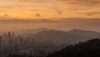 Fototapeta premium Panoramic City Skyline and Layers of Mountains at Golden Hour