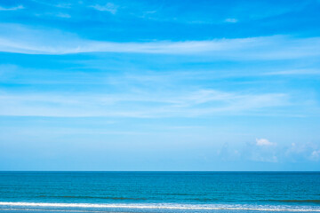 Nature of the ocean and blue sky Summer with sunshine, sandy beaches, clear blue waters sparkling against the blue sky. on an island with good ecology and environment Background for summer vacation