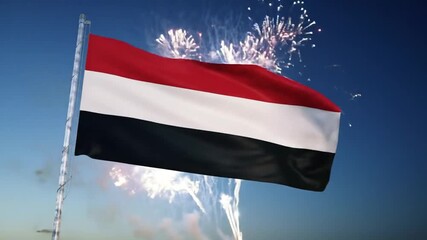 National flag of Yemen waving proudly against a backdrop of vibrant fireworks.