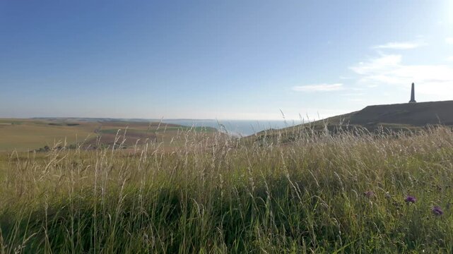 Cap Blanc-Nez, Escalles, Pas-de-Calais, Hauts-de-France, France, July 29th, 2025, A stunningly picturesque view of the beautiful coast featuring gently swaying grass and a historic monument