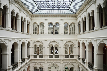 Interior view of classic building with white arches and columns. Concept of culture, architecture...