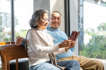 Senior asian couple using smartphone together for telehealth services, online doctor consultation, elderly care, digital health support, medical apps, healthtech and digital connection in retirement