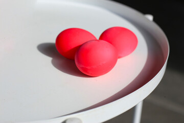 Pink preserved eggs (century eggs) on a white table