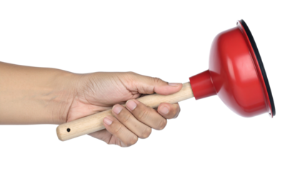 A person's hand holding a red plunger with a wooden handle, commonly used for unclogging drains.