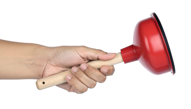 A person's hand holding a red plunger with a wooden handle, commonly used for unclogging drains.