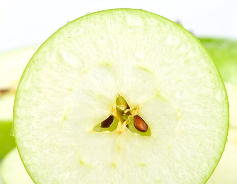 Close-up of a sliced green apple - Powered by Adobe