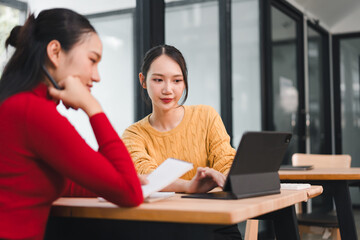Young woman student tablet classroom study coworking casual sweater yellow sweater Asian woman