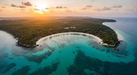 Fototapeta premium Breathtaking aerial view of tropical island beach and coral reefs at sunset
