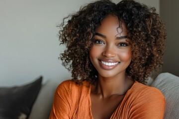 Portrait of smiling young African American woman with curly hair sitting on the sofa at home, looking confidently at the camera with a warm and inviting smile, Generative AI