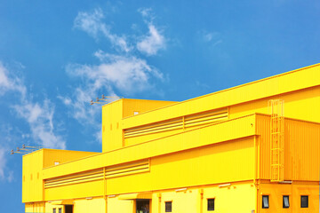 architecture design square shape corrugated wall geometric buiding. The factory warehouse is exterior decorated with corrugated texture to create a point of interest with beautyl