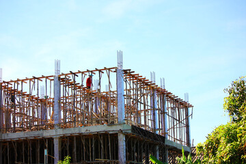 construction worker preparing wooden support structure before pouring concrere beam