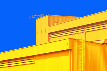 architecture design square shape corrugated wall geometric buiding. The factory warehouse is exterior decorated with corrugated texture to create a point of interest with beautyl