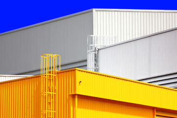 architecture design square shape corrugated wall geometric buiding. The factory warehouse is exterior decorated with corrugated texture to create a point of interest with beautyl