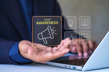 Boost Awareness Marketing Concept with Businessman Hand Holding Digital Megaphone Icon and Social Media Engagement Symbols for Brand Promotion Strategy and Online Advertising