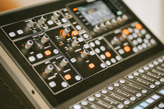Mixing console in action at a music studio during a recording session for an upcoming album