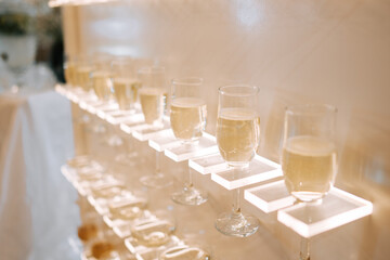 Elegant display of sparkling drinks illuminated at a special event venue