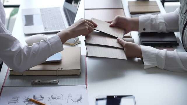 Interior Designer Consulting with Client on Material Selection