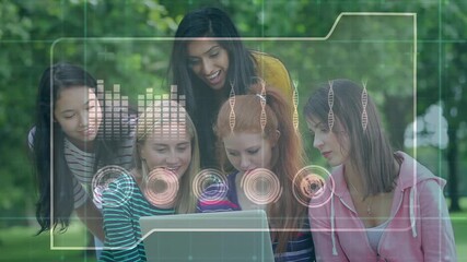 Animation of data processing interface over happy diverse female students using laptop outdoors - Powered by Adobe