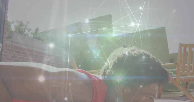Animation of network of connections over african american fit man preforming push up exercise