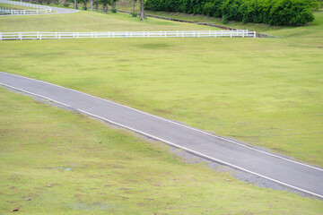 Relax and wellness concept with road in garden and mountain background at chiangmai thailand in raining season